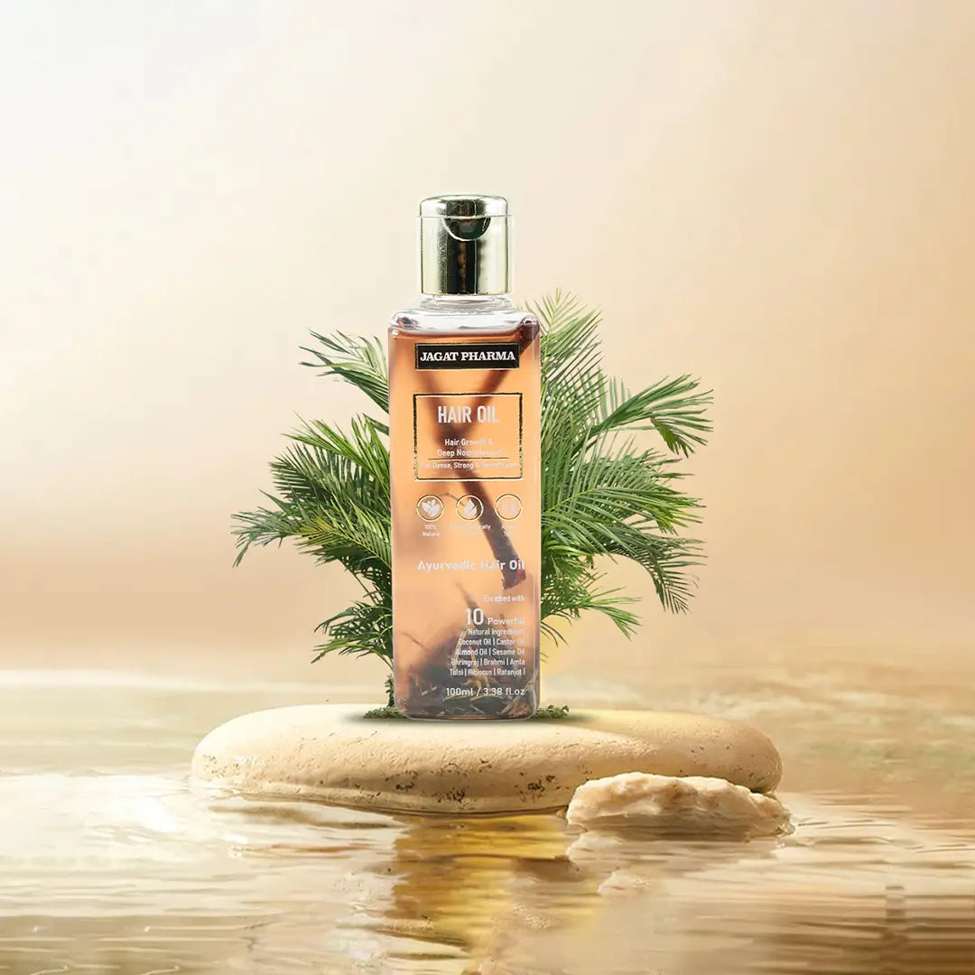 A bottle of Jagat Pharma Hair Oil stands on a small stone platform in shallow water, surrounded by green palm leaves against a warm beige background.