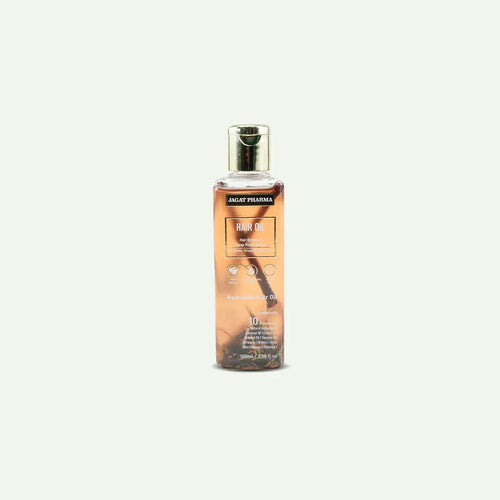 A bottle of Jugal Pharma Hair Oil with a metallic silver cap, containing amber-colored oil with visible hair strands inside, set against a solid off-white background.