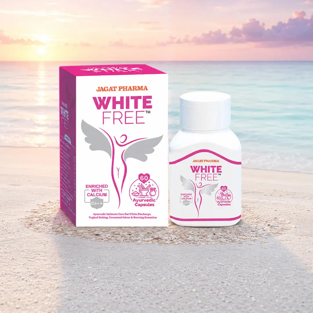 A bottle and box of Jagat Pharma White Free dietary supplement displayed on a sandy beach with a sunset ocean background.